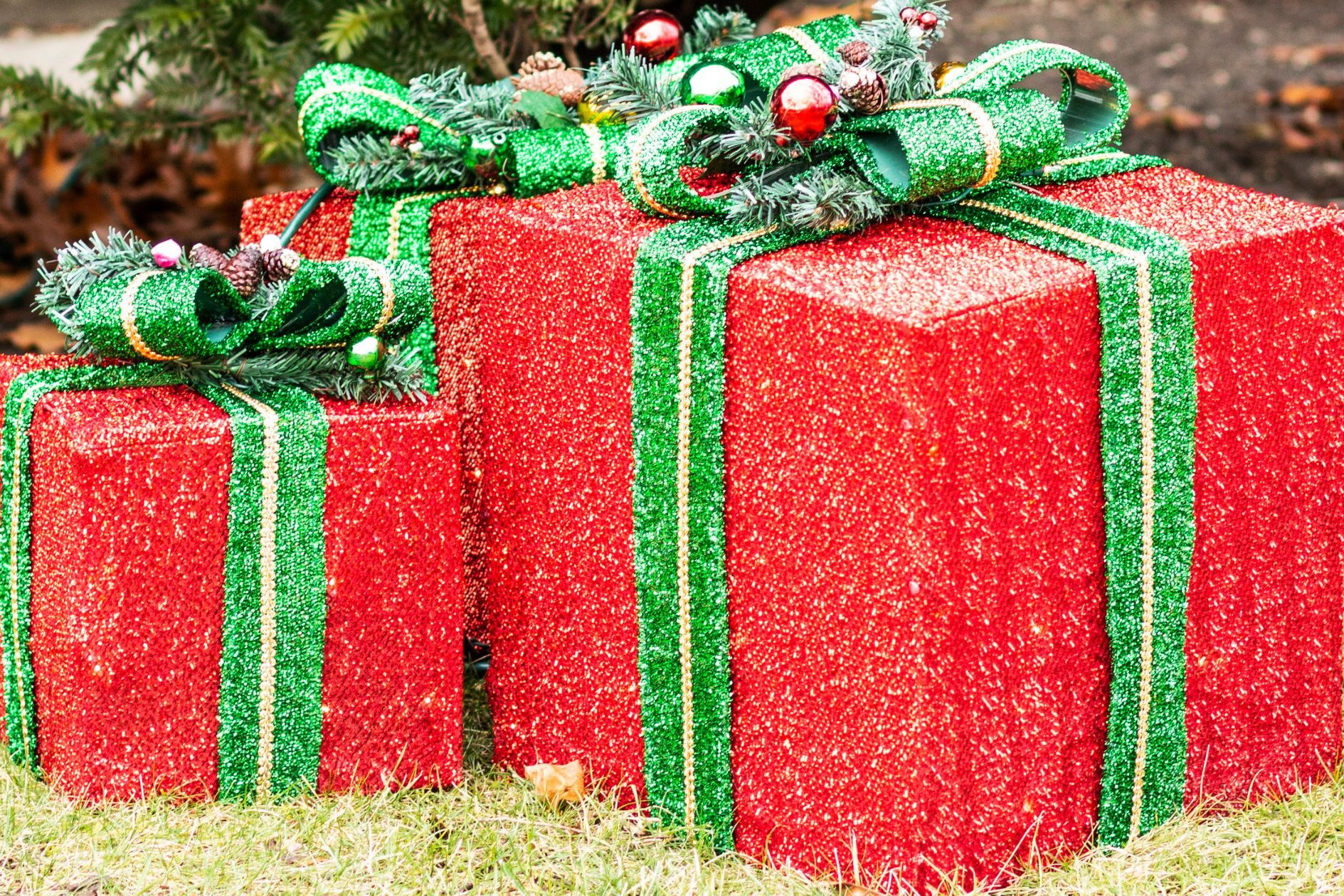 red and green holiday presents lawn decor