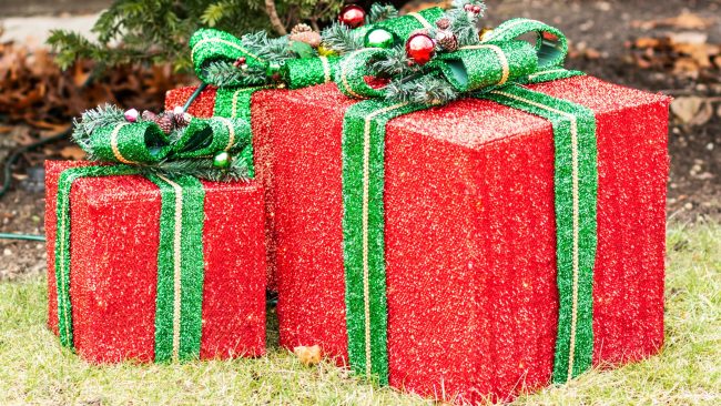 red and green holiday presents lawn decor