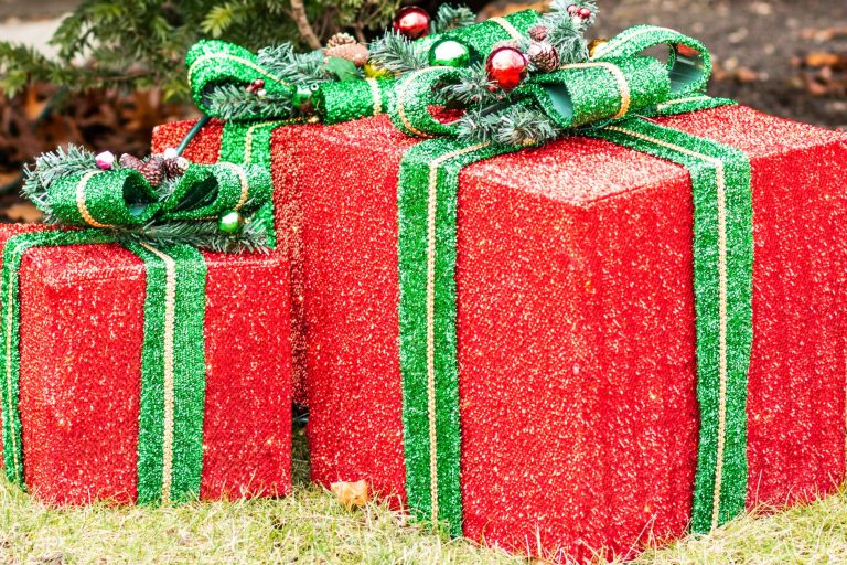 red and green holiday presents lawn decor